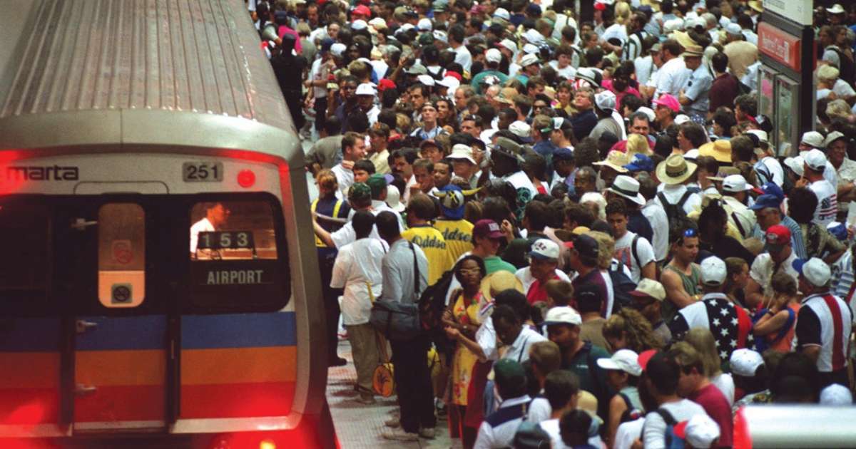 A crowd gathered at a MARTA station to take a train to the airport