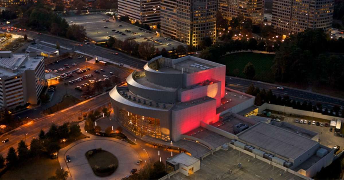 The exterior of the Cobb Energy Performing Arts Centre at night, a top night life spot