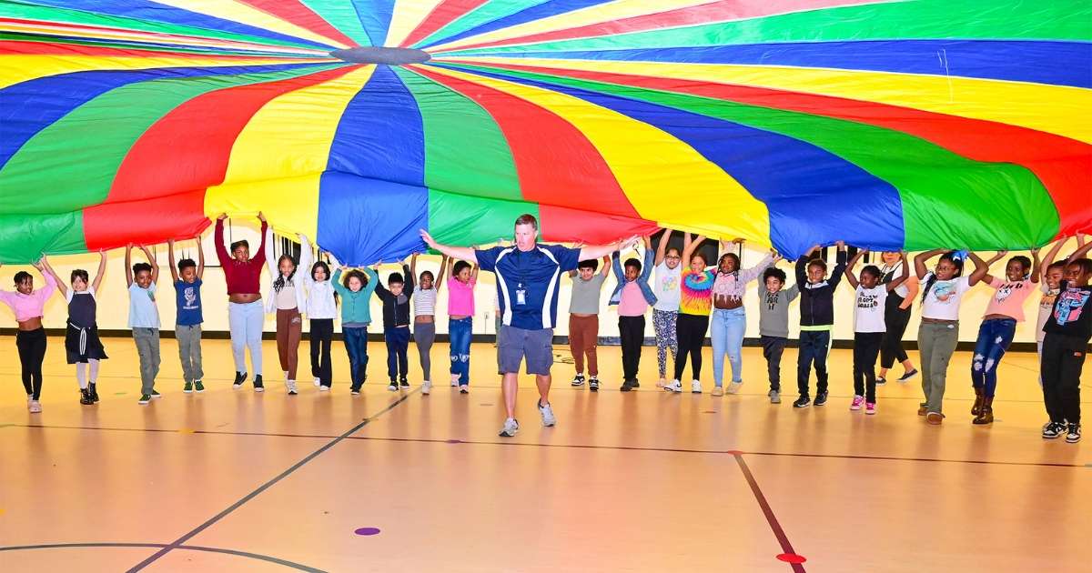Students making a parachute net at Henry County Schools