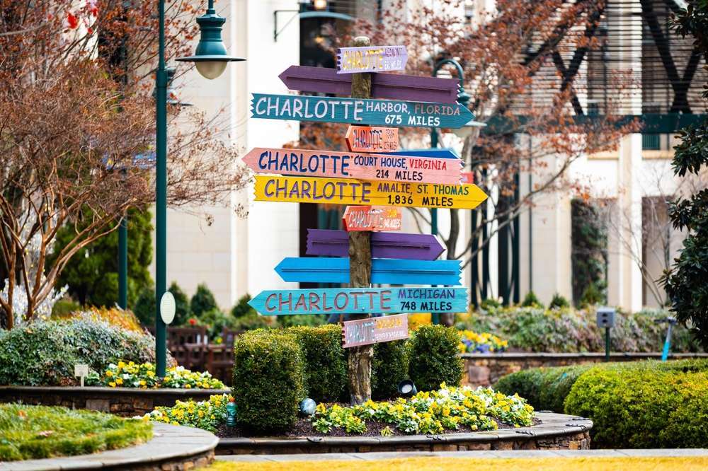 charlotte sign downtown showing which direction the city's main points are
