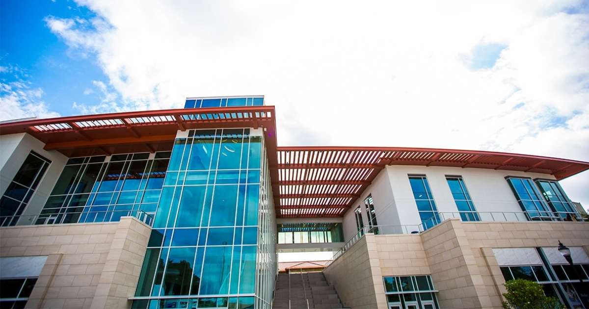 A building at Emory University on a partly cloudy day