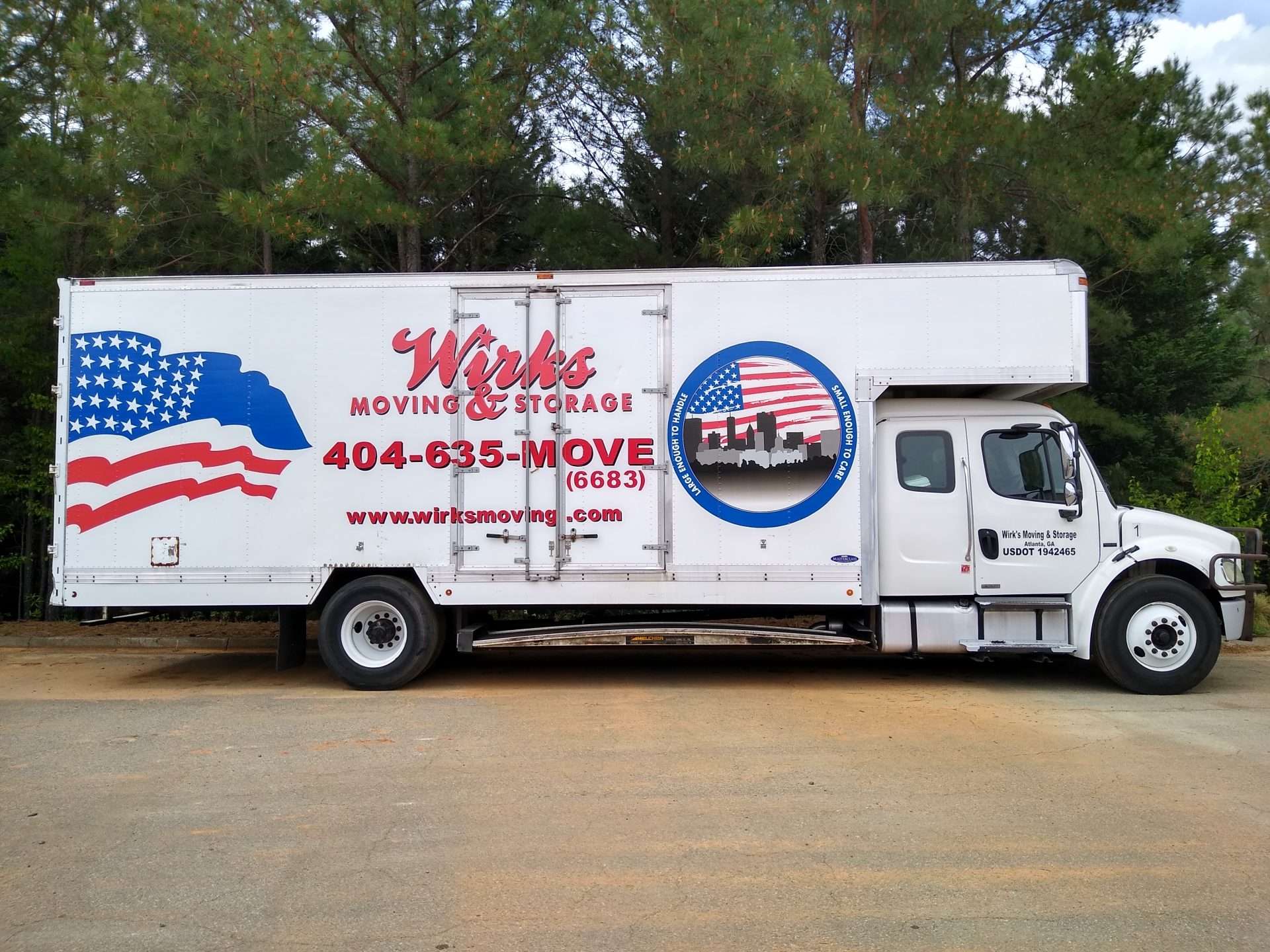 Wirks Moving & Storage truck parked in business parking lot.