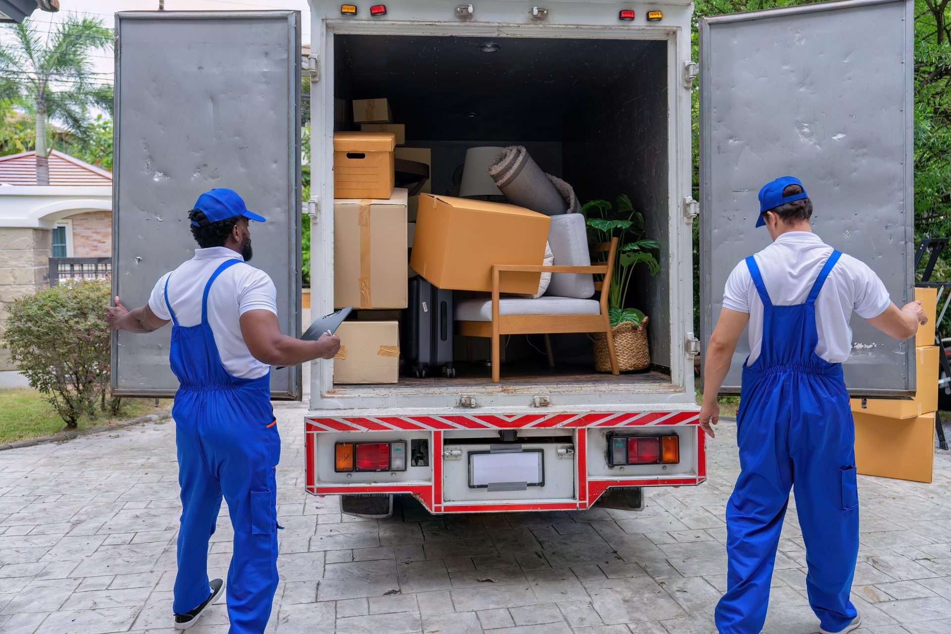 Movers in Jasper GA closing the back of a truck full of belongings