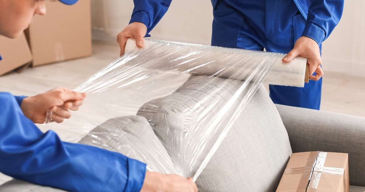 Locust Grove movers carefully wrapping furniture. 