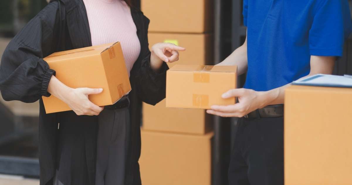 Movers from Atlanta to Durham handling cardboard boxes
