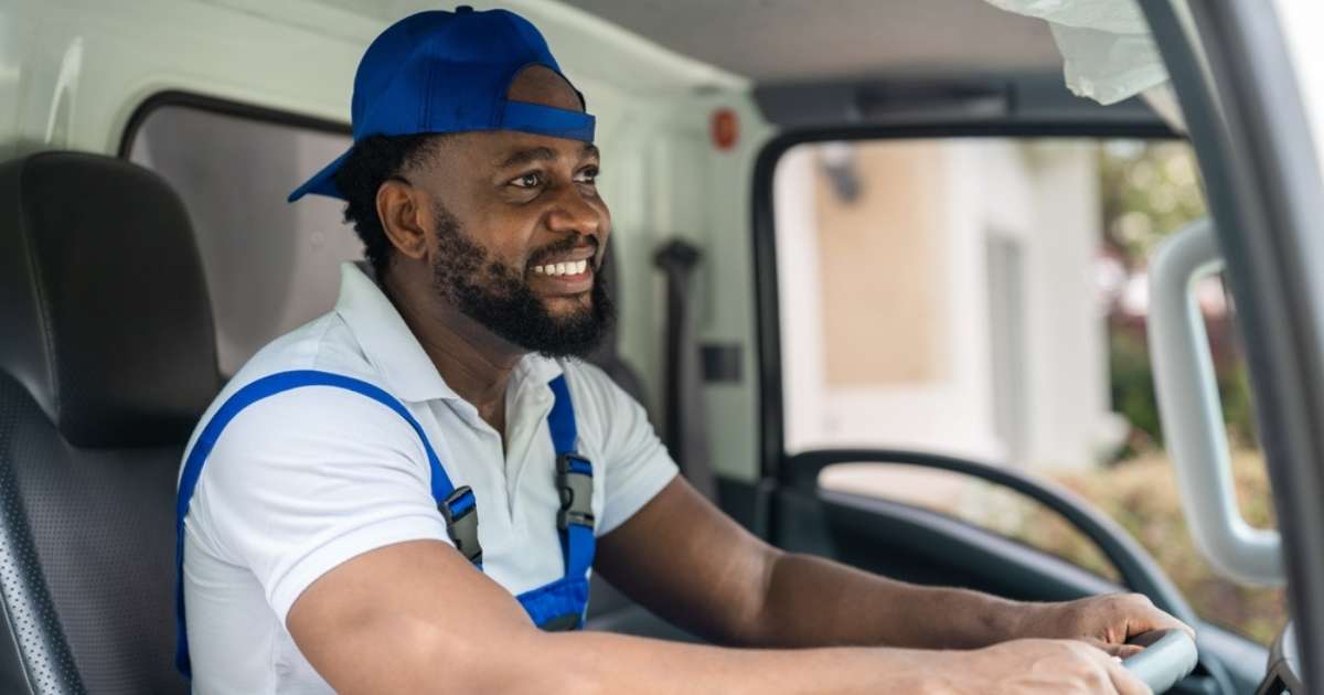 A moving professional from a moving company in Newnan driving a moving truck