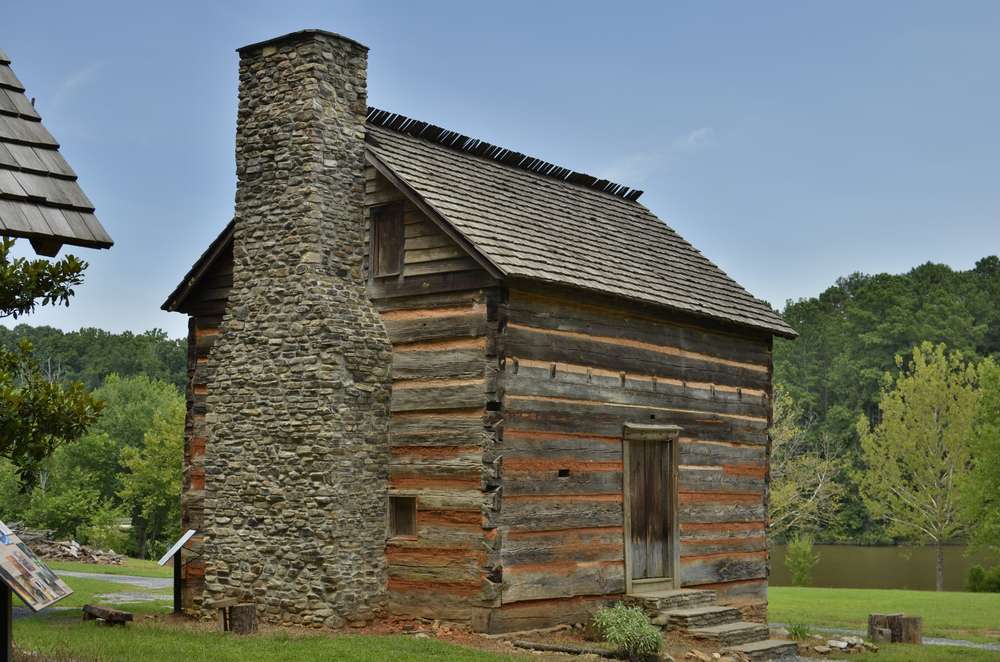Old log home shown at fort yargo state park