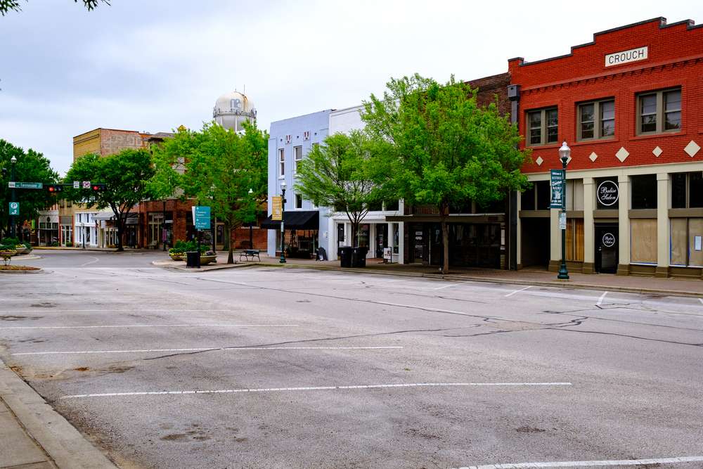 Downtown area of mckinney texas with a row of stores